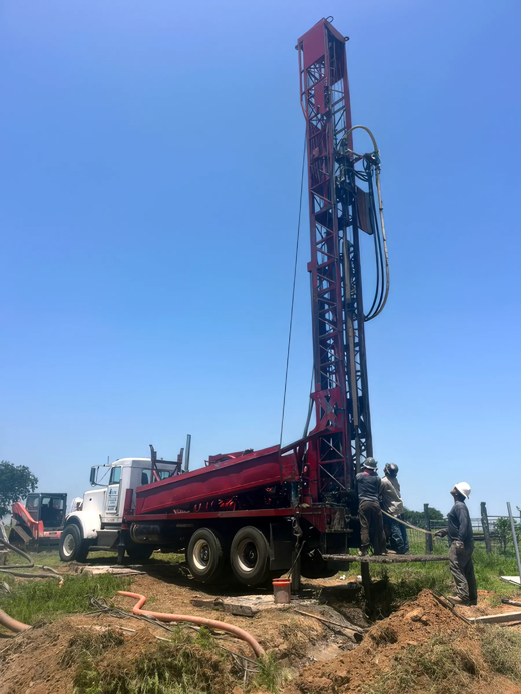 DFW Well Service water well drilling rig at work in Grayson County, Texas